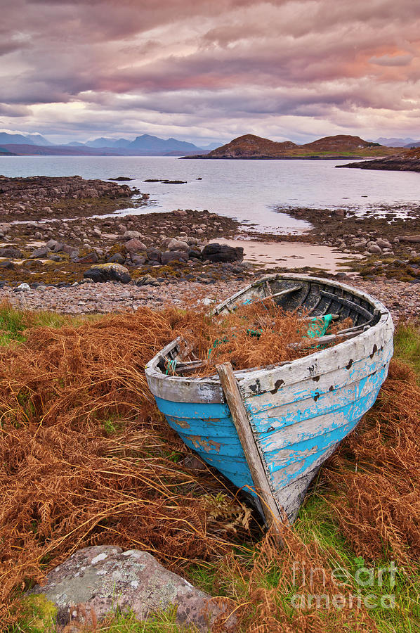Blue fishing boat at sunset, Inverasdale, Loch Ewe, Wester Ross, Scotland Photograph by Neale And Judith Clark