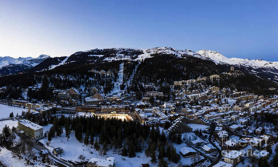 Blue hour over the famous Crans-Montana village in Switzerland Photograph by Didier Marti