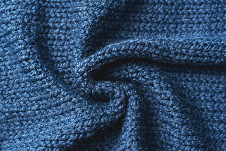 Blue knitted Jersey as textile background. Trendy classic blue color textule as color of year 2020 concept. Copy space for text and design. Photograph by Kseniya Ovchinnikova