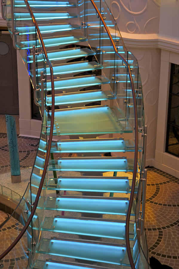 Blue-lit free-form staircase. Photograph by Barry Winiker