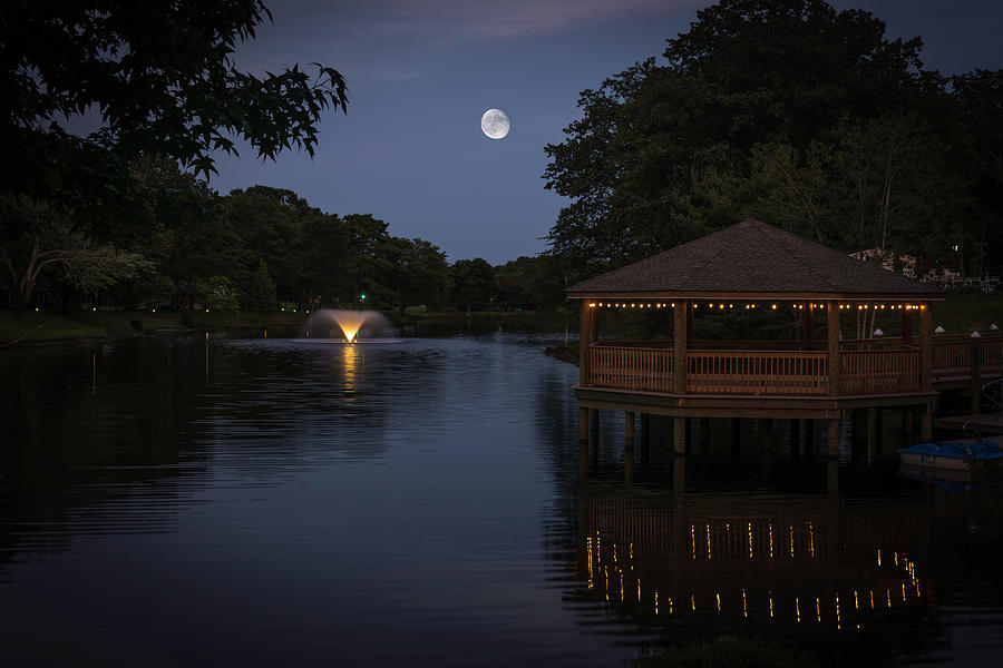 Blue moon over Lake Vista Photograph by Kenneth Cole