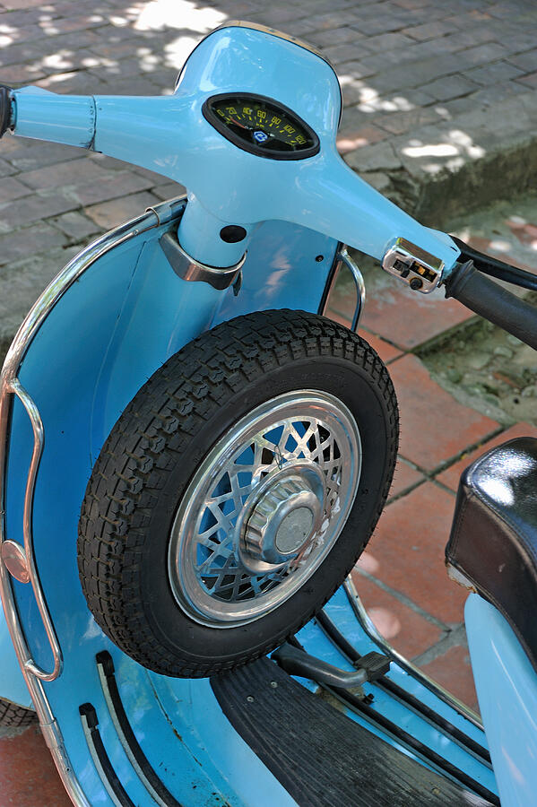Blue motor scooter with spare tire Photograph by Sami Sarkis