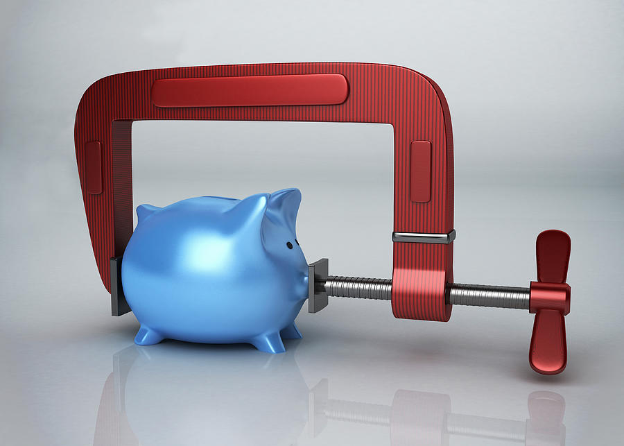 Blue piggy bank in clamp over colored background representing growth of money Drawing by Fanatic Studio