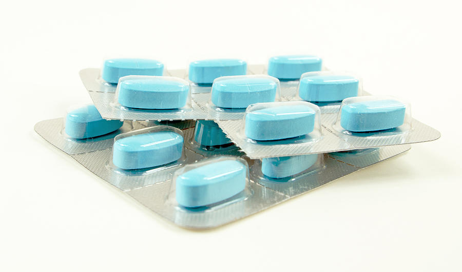 Blue Pills Sealed in Plastic Photograph by Wwing