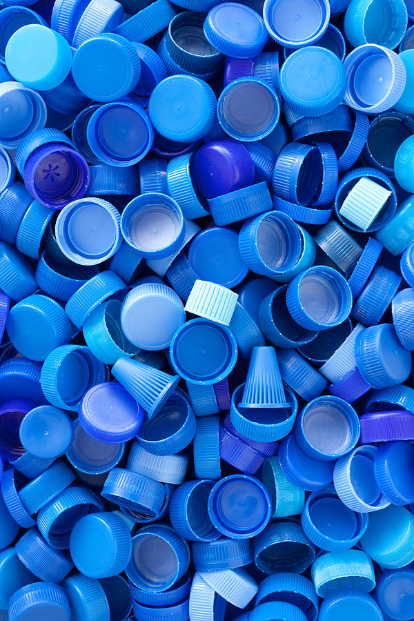 Blue plastic caps background Photograph by FotografiaBasica