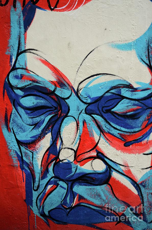 Blue red and white abstract graffiti mural portrait of man London England Photograph by Imran Ahmed