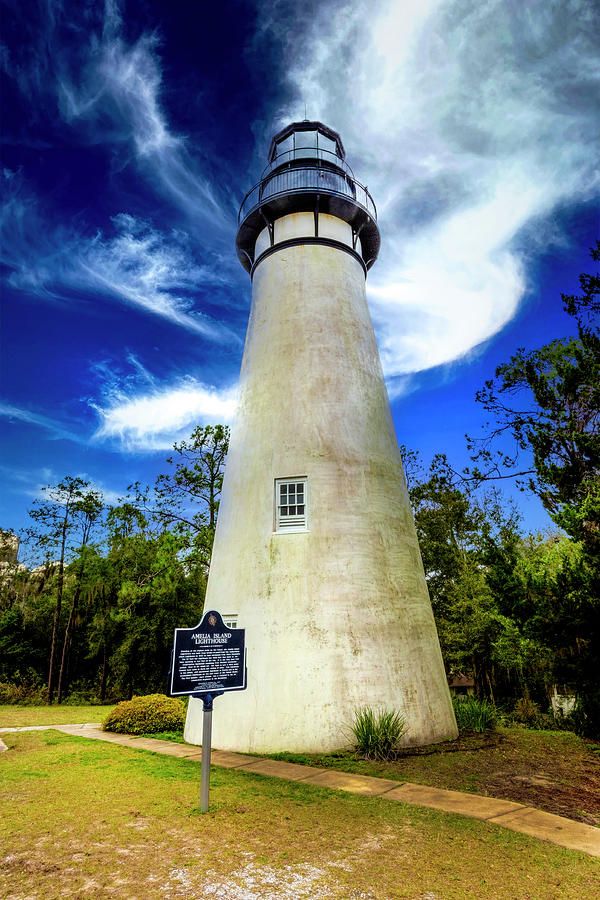 Blue  Sky and White Clouds at the Amelia Island Lighthouse Photograph by Debra and Dave Vanderlaan