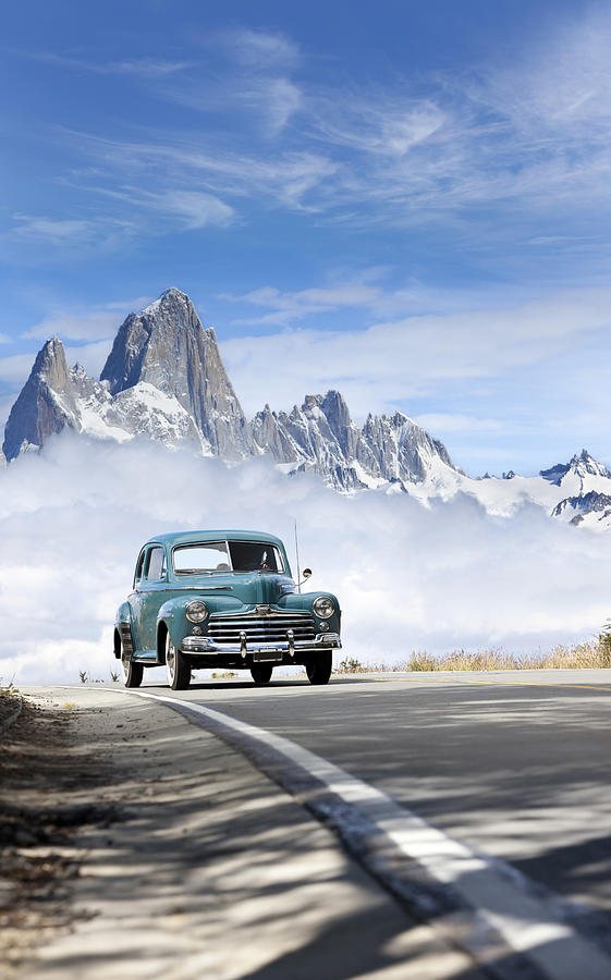 Blue sky over antique car driving in Patagonia Argentina Photograph by Grafissimo