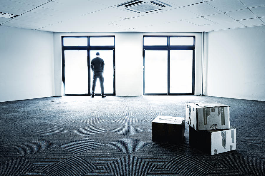 Blue-toned empty office showing business failure Photograph by Sproetniek
