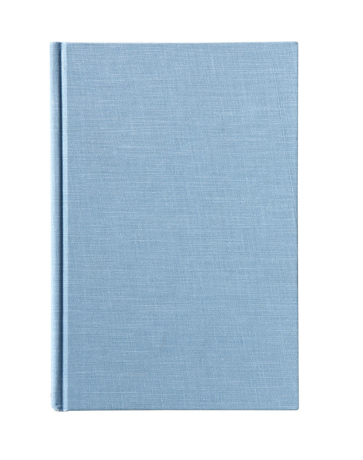 Blue workbook on white background Photograph by Thomas Northcut