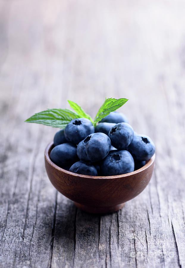 Blueberries  in wooden bowl close up Photograph by Jelena Jovanovic