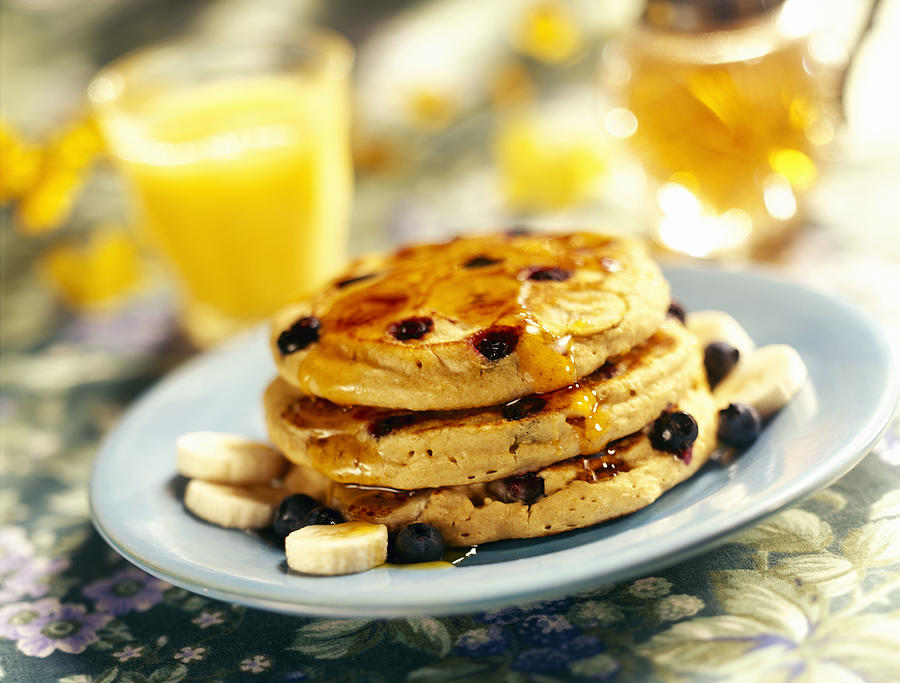 Blueberry banana pancakes with syrup Photograph by Lew Robertson