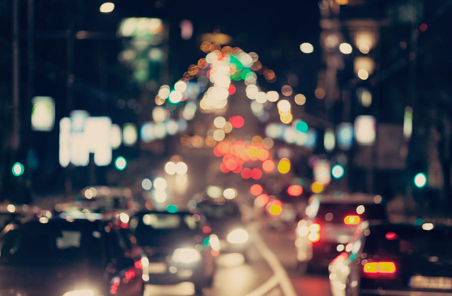 Blurred background. Night city lights blur. Retro toned photo, vintage.  Photograph by Julien - Pixels
