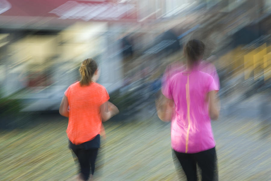 Blurred image of two female joggers Photograph by Lyn Holly Coorg