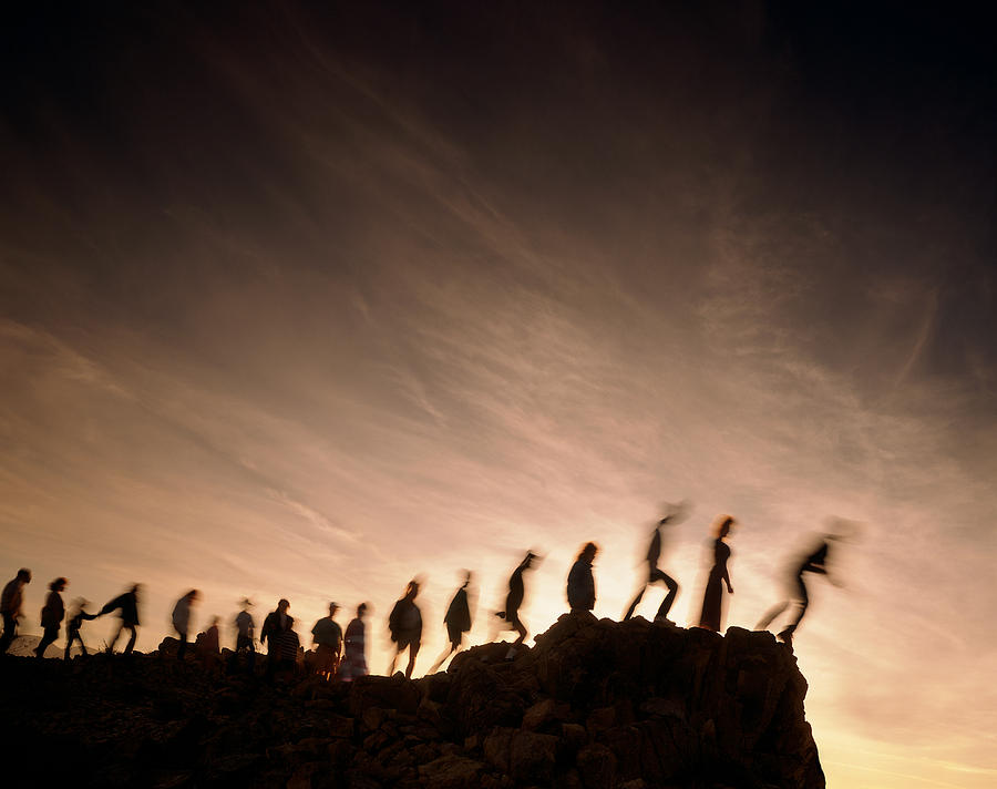 Blurred line of people on the edge of a cliff Photograph by Byllwill