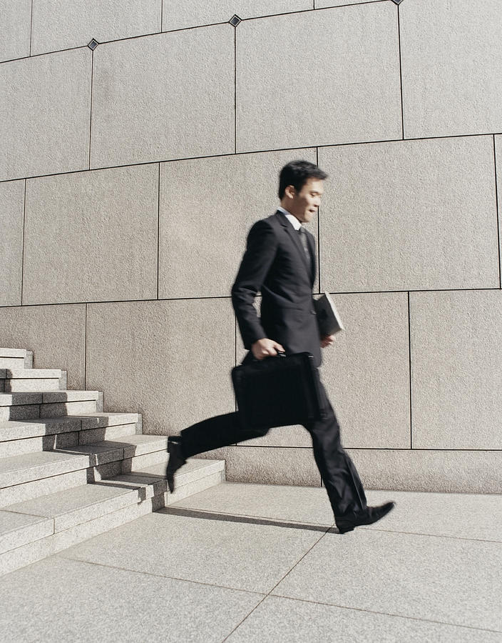 Blurred Motion Shot of a Businessman Descending Stone Steps Photograph by A J James