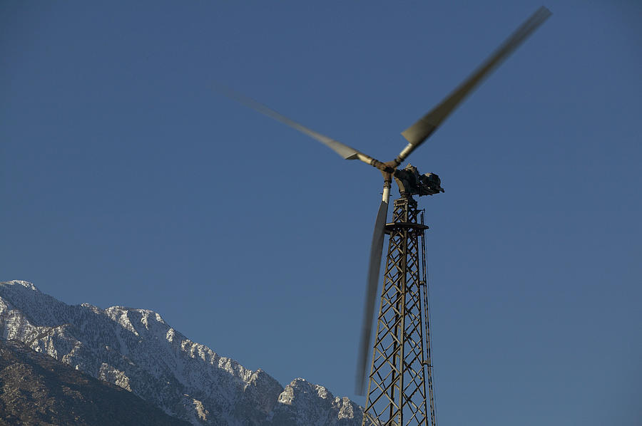 Blurred Motion Shot of a Revolving Wind Turbine Photograph by Digital Vision.