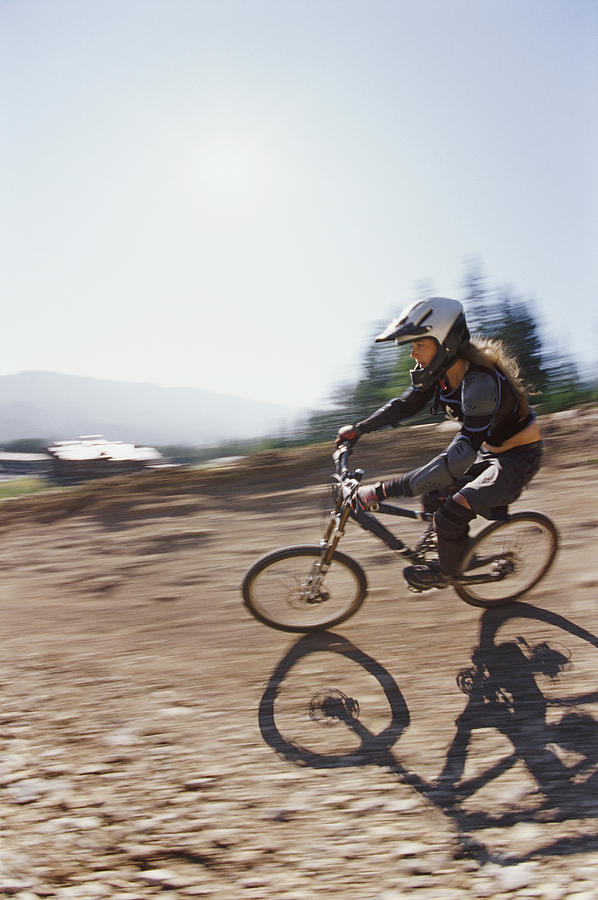 Blurred Motion Shot of a Woman Riding a BMX on a Dirt Track Photograph by Darryl Leniuk