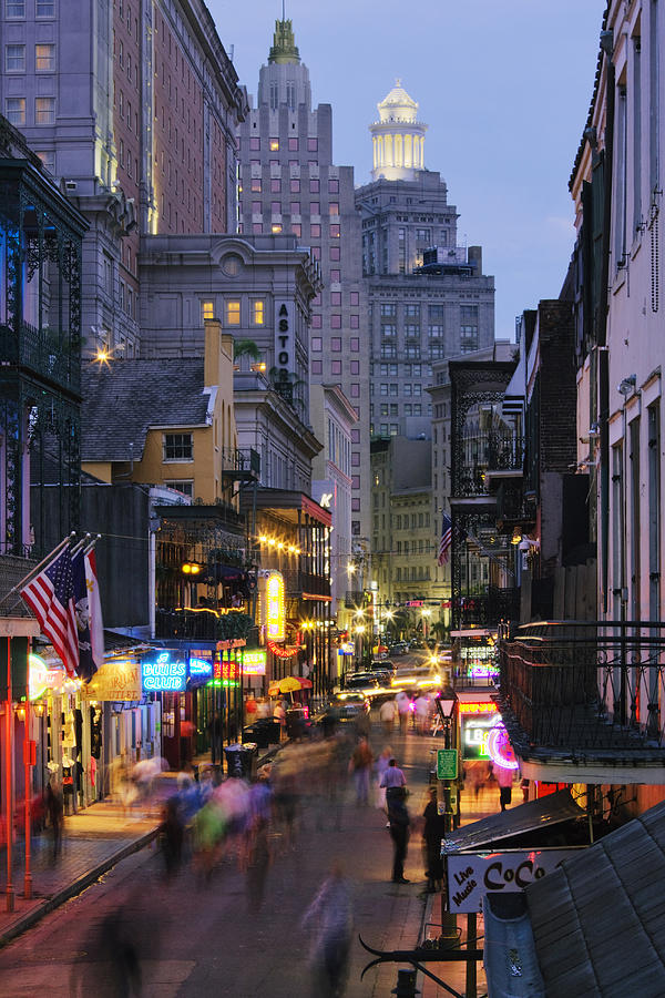 Blurred motion view of tourists on Bourbon Street at night, New Orleans, Louisiana, United States Photograph by Jeremy Woodhouse