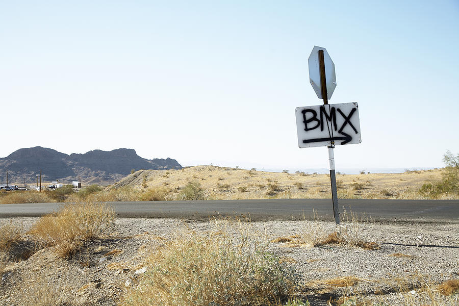 BMX sign painted on road sign Photograph by Karen DSilva