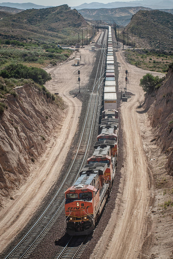 BNSF 7784 leads three other units west at Cajon Pass Photograph by Jim Pearson