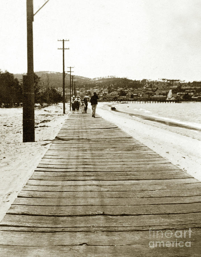 Beach Photograph - Boardwalk leading to Monterey from the Del Monte Hotel on Del Monte Beach,  Circa 1910 by Monterey County Historical Society