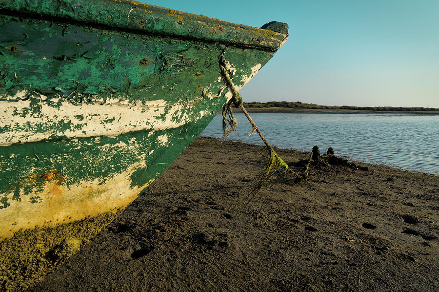 Boat and coming tide Photograph by Angelo DeVal