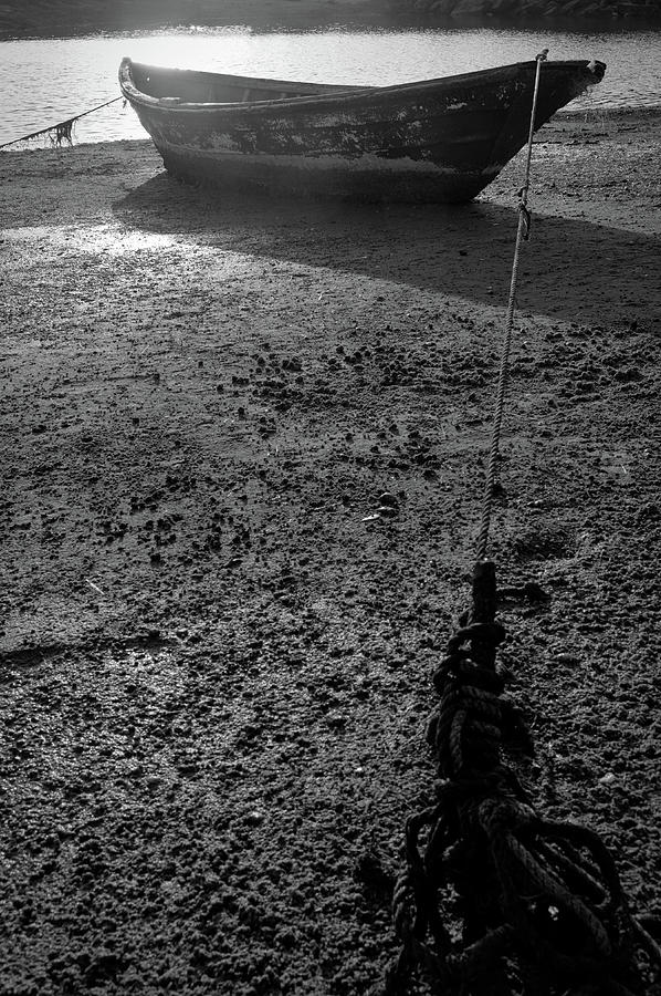 Boat and coming tide in monochrome Photograph by Angelo DeVal