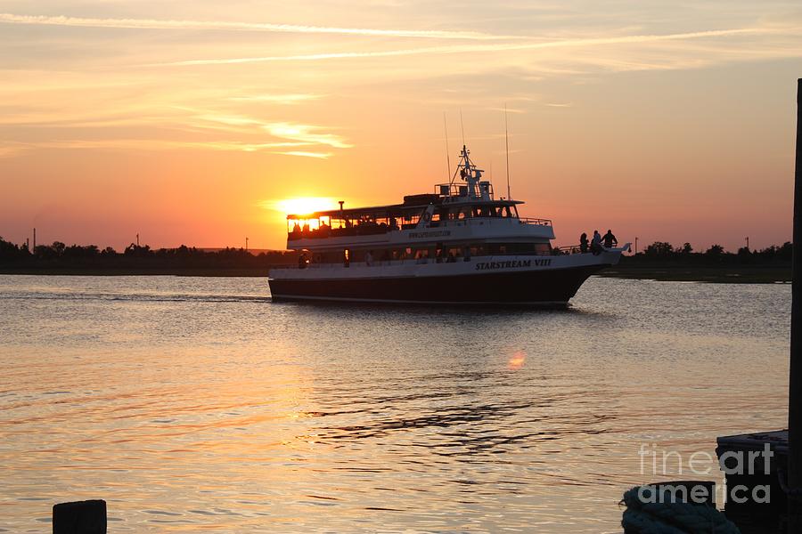 Boat Cruising In Front Of The Sunset On Long Island Photograph by Barbra Telfer