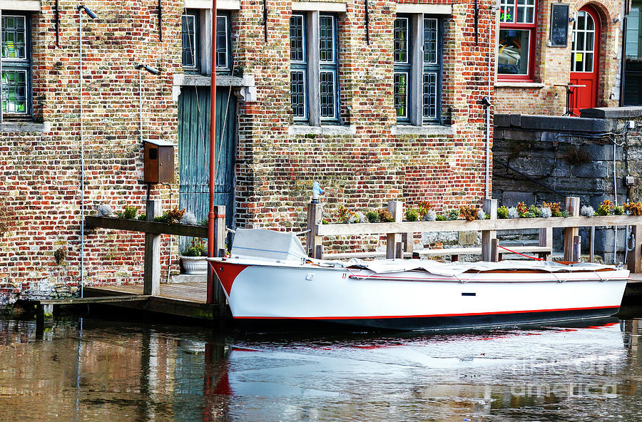 Boat Docked in Bruges Photograph by John Rizzuto