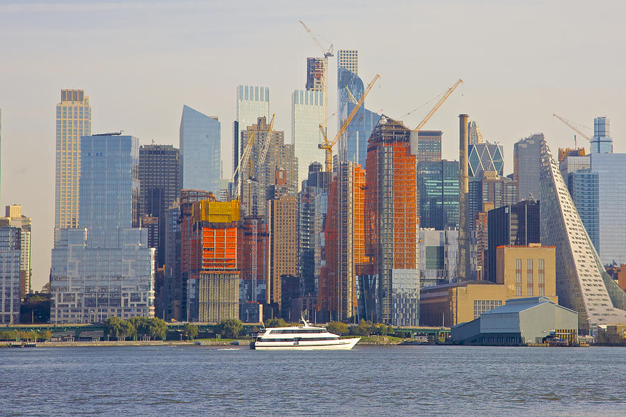 Boat on Hudson River near towers of Midtown West, Manhattan, seen from New Jersey Photograph by Barry Winiker