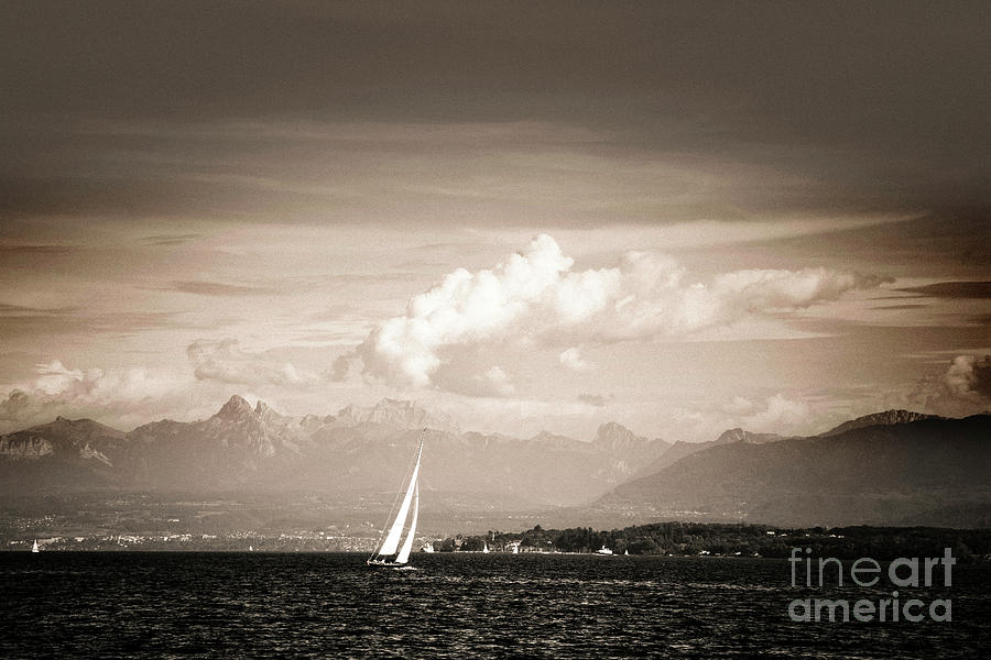 Boat on lake Geneva near Nyon, in the background the French Alps