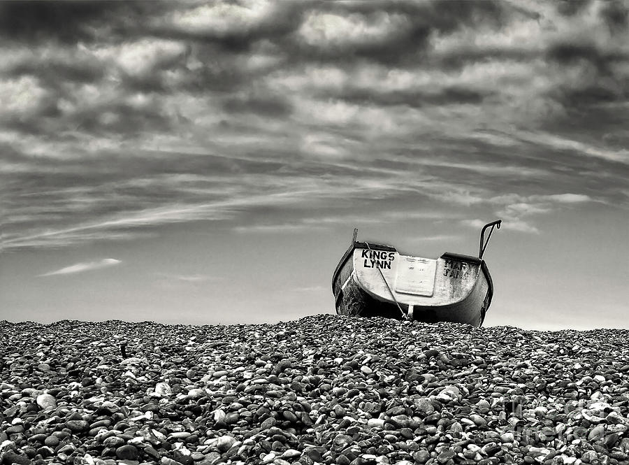 boat on shore lonely left over Cley Next the Sea,  Norfolk UK Photograph by Tatiana Bogracheva