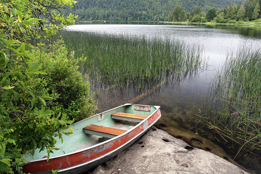 Boat on St. Mary Lake Photograph by Michael Russell