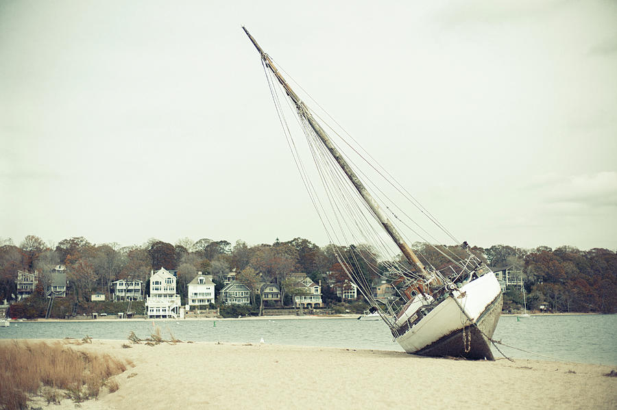 Boat on the shore after Hurricane Sandy Long Island Photograph by Eugene Nikiforov