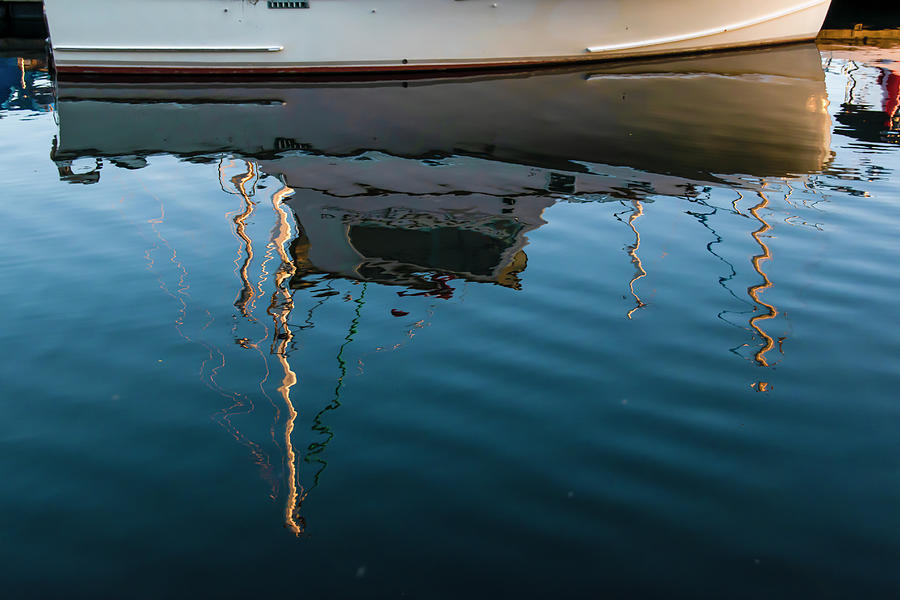 Boat Reflecting In The Rippled Water Photograph