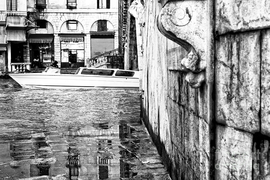 Boat Under the Rialto Bridge in Venice Italy Photograph by John Rizzuto