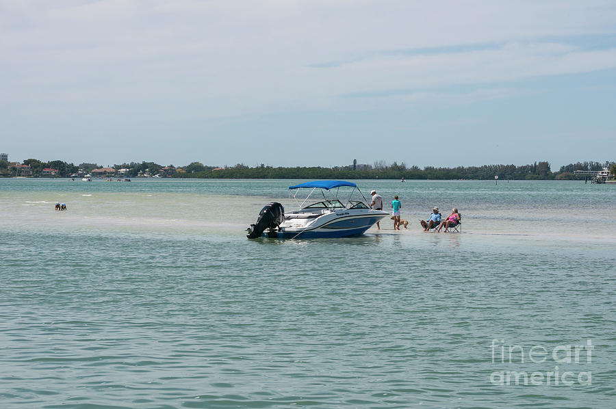Boaters relax on a sand bar in Sarasota Bay at Sarasota, Florida Photograph by William Kuta