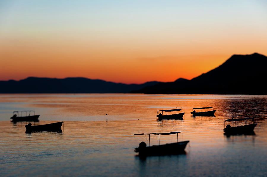Landscape Photograph - Boats on Lake Chapala at Sunset by Dane Strom