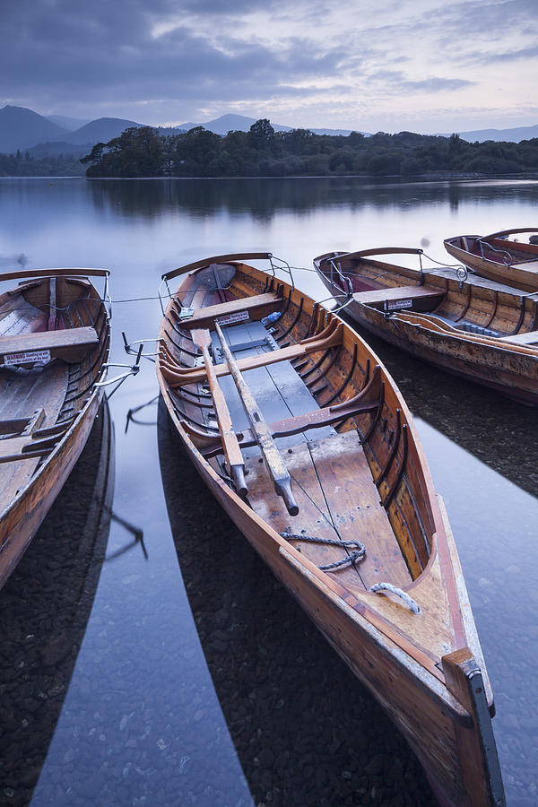 Boats on the shore of Derwent Water. Photograph by Julian Elliott Photography