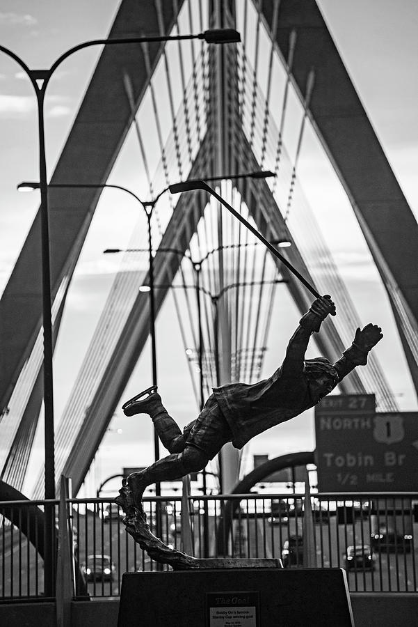 Bobby Orr Statue leaping through the Zakim Bridge at Sunset Boston MA Black and White Photograph by Toby McGuire