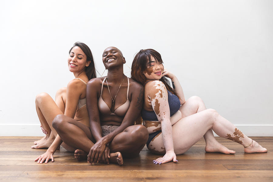 Body positivity - women friends posing at home in lingerie Photograph by LeoPatrizi