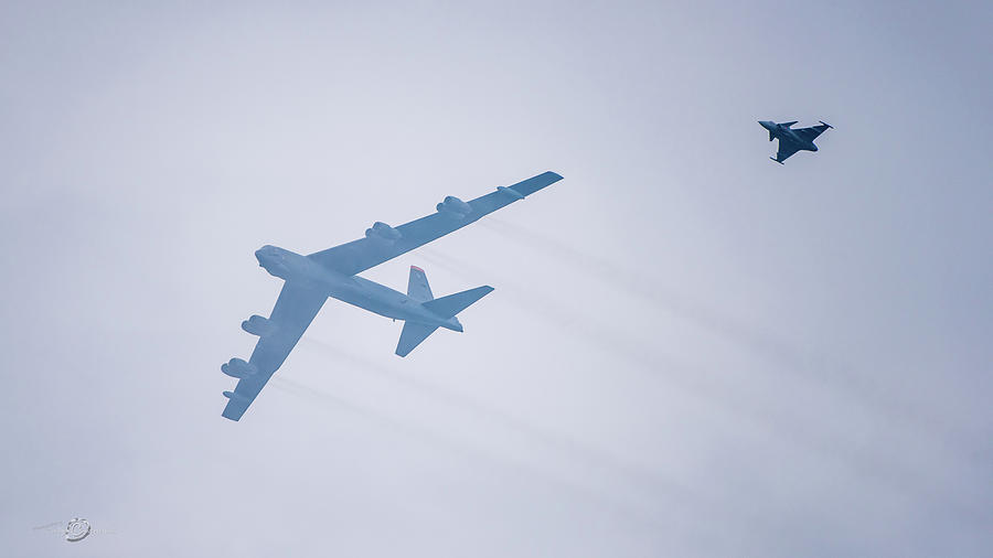 Boeing B-52H Stratofortress SPICY62 accompanied by JAS 39 Gripen Photograph by Torbjorn Swenelius