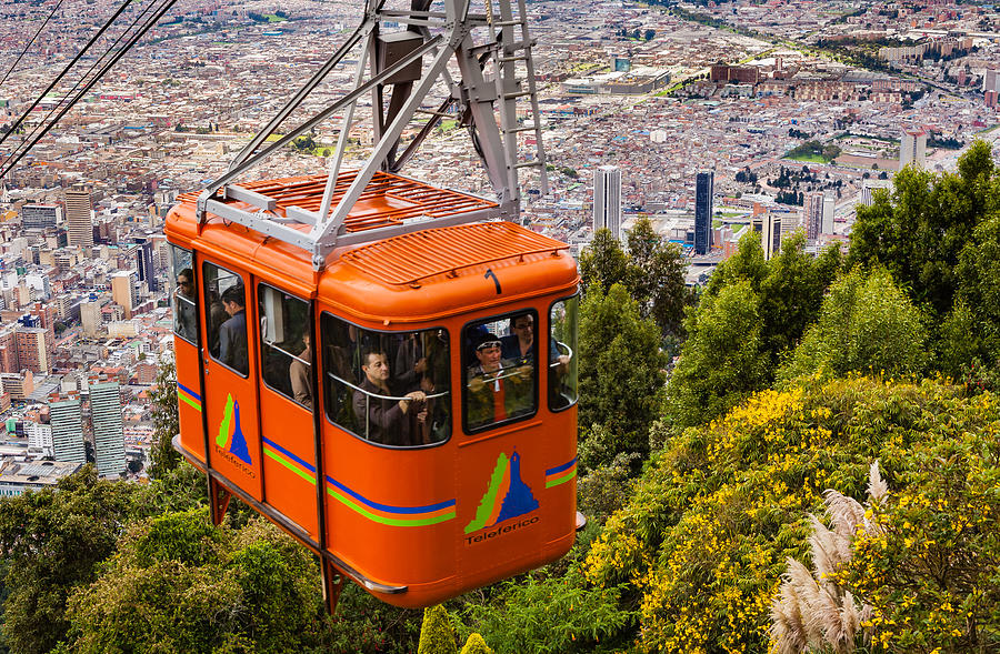 Bogota, Colombia - A Cable Car Approaches The Andes Mountain Peak Of Monserrate 1,500 Feet Above the Capital City Which Is Located At About 8,500 Feet Above Mean Sea Level. Photograph by Devasahayam Chandra Dhas