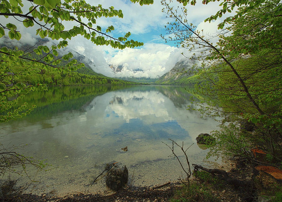 Bohinjsko jezero between mountains in Slovenia Photograph by Mikhail Kokhanchikov