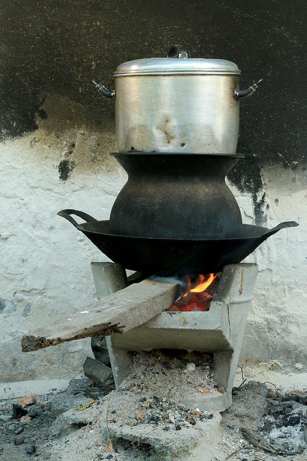 Boil steam pot on bon fire stove Photograph by Ko_orn