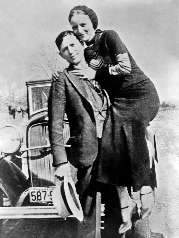 Bonnie and Clyde With Their Car - Circa 1934 Photograph by War Is Hell Store