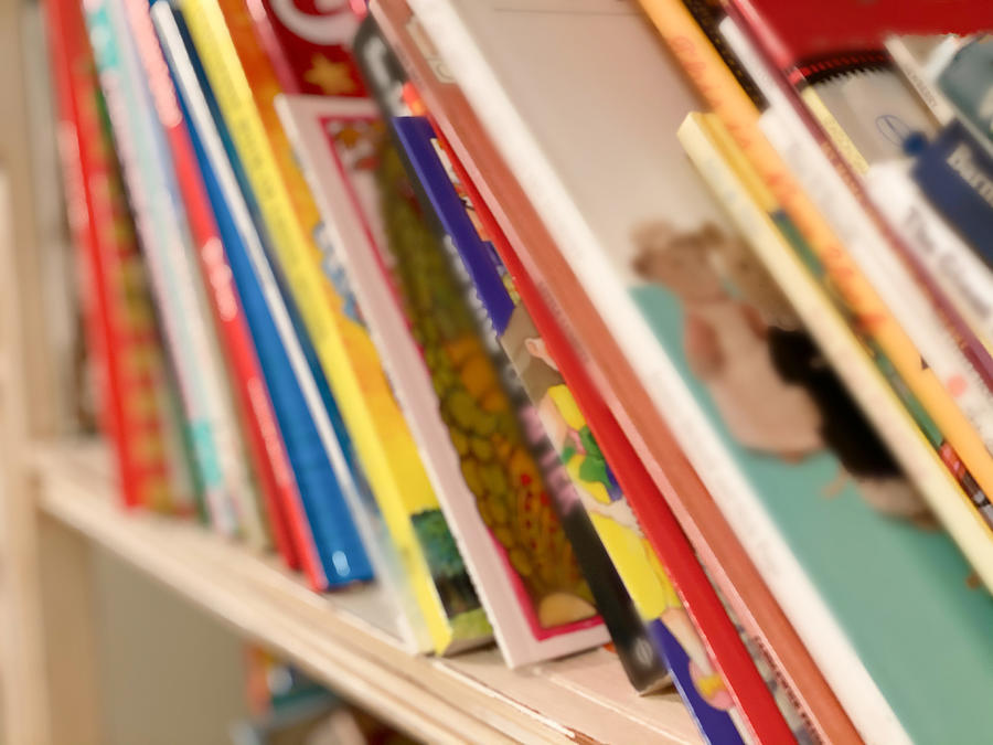 Bookshelf Loaded With Children’s Books In Toddler Girl’s Bedroom Photograph by Catherine McQueen