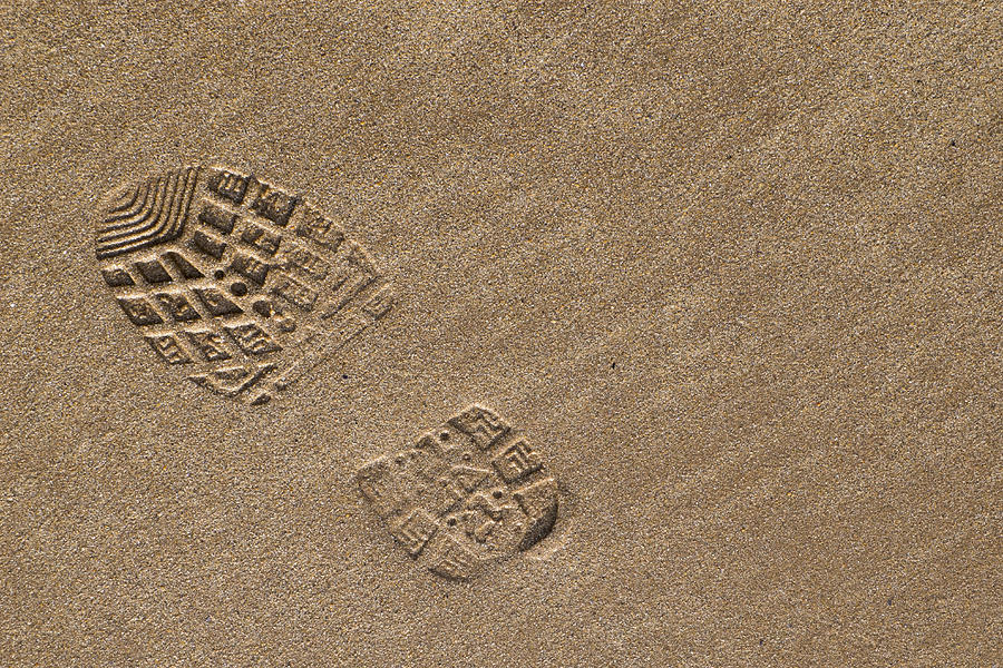Boot / Foot print on the sandy beach Photograph by Jason Friend Photography Ltd