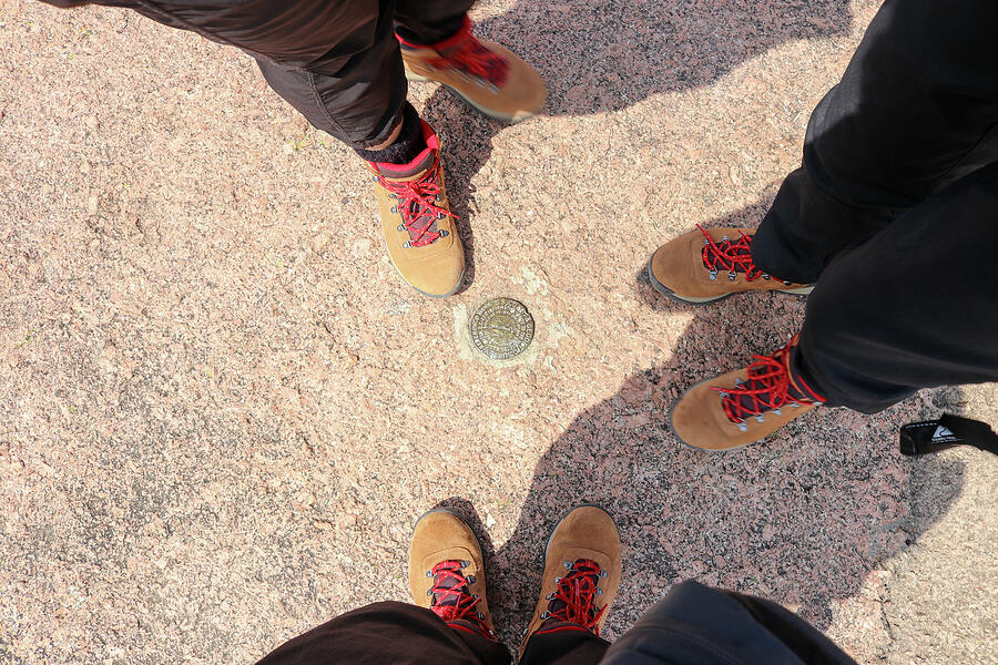Boots on the summit survey medallion - Enchanted Rock State Park, TX Photograph by Brigitte Blanchette Thompson Boots on the summit survey medallion - Enchanted Rock State Park, TX Photograph by Brigitte Blanchette Thompson